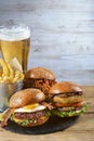 Hamburgers with fries and a glass of beer