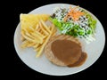 Hamburgers steak with french fries, bread and Vegetable isolated Royalty Free Stock Photo