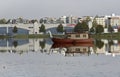 A boat with steely dragon head on a calm lake in autumn day