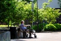 Hameenlinna, Finland 06/08/2019 An elderly disabled woman with her walker in a park.