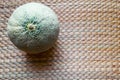 Hami Melon Fruit on Brown Straw Mat Background Surface Royalty Free Stock Photo