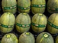 hami melon stacked in the market place