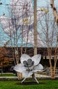 Hamilton, Ohio urban park with metal flower sculpture and flying bird mural. Royalty Free Stock Photo