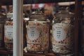 Hamiltons retro sweets in jars in a window of a shop in Broadway, Cotswolds, UK