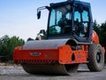 Hamm road roller on street construction site in the morning.