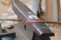 Hammer anvil with iron stick