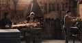 Hammer, anvil and sparks with a men working in a foundry for metal work manufacturing or production. Industry, welding Royalty Free Stock Photo