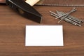 Hammer with badge and nails on table Royalty Free Stock Photo