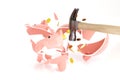 Hammer breaking a piggy bank with some coins isolated on white background. Crisis concept. 3d illustration