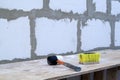 hammer and brush are on the foam blocks on the construction of a Royalty Free Stock Photo