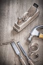 Hammer chisels and planner on wood Royalty Free Stock Photo