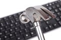 Hammer and computer keyboard Royalty Free Stock Photo