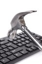Hammer and computer keyboard Royalty Free Stock Photo