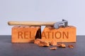 Hammer on a destruction brick as a symbol breaking relation. Concept breaking Royalty Free Stock Photo