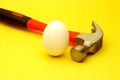 Hammer and egg Royalty Free Stock Photo
