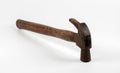 The hammer head is rusty and the crest of the nail is broken Royalty Free Stock Photo