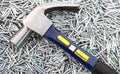 Hammer on heap of Silver nails Royalty Free Stock Photo