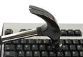 Hammer hitting computer keyboard Royalty Free Stock Photo