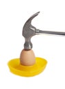 Hammer hitting egg Royalty Free Stock Photo
