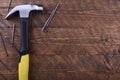 Hammer iron on wooden background