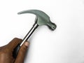 Hammer isolated on white background. Hand holding a hammer and nail puller, two in one. Royalty Free Stock Photo
