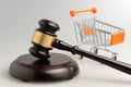 Hammer of judge and pushcart on gray Royalty Free Stock Photo