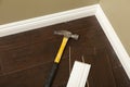 Hammer, Laminate Flooring and New Baseboard Molding