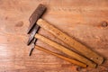 Hammer lies on a workbench or wooden board