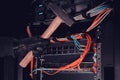 Hammer in man hand near computer networking equipment with wires Royalty Free Stock Photo