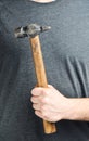 Hammer in the man`s hand. Royalty Free Stock Photo