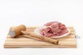 Hammer for meat and raw meat prepared for frying Royalty Free Stock Photo