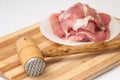 Hammer for meat and raw meat prepared for frying Royalty Free Stock Photo