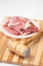 Hammer for meat and raw meat prepared for frying Royalty Free Stock Photo