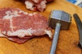 Hammer for meat and raw meat prepared Royalty Free Stock Photo