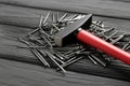 Hammer and metal nails on black table, closeup Royalty Free Stock Photo