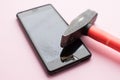 Hammer and mobile phone with broken display Royalty Free Stock Photo