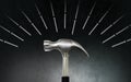 Hammer and nails on dark background