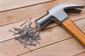 Hammer and nails on wood background Royalty Free Stock Photo