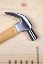 Hammer and nails on wooden background Royalty Free Stock Photo