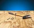 Hammer and nails on the wooden table Royalty Free Stock Photo