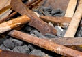 hammer and other old tools over the pieces of coal in an artisanal factory where iron is worked Royalty Free Stock Photo