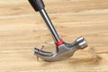 Hammer pull out a bent nail fixed in a wooden board Royalty Free Stock Photo