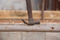 Hammer pulling a nail out of wood Royalty Free Stock Photo