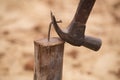 Hammer pulling a nail out of wood Royalty Free Stock Photo