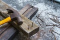 Hammer, rusty nail and wood for carpenter`s job