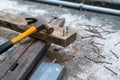 Hammer, rusty nail and wood for carpenter`s job