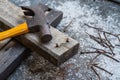 Hammer, rusty nail and wood for carpenter`s job