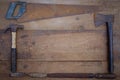 collection of woodworking old handtools on a rough workbench wooden