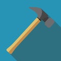 A hammer with a shadow. A colored icon. A percussion hand tool used for hammering nails, smashing objects and other work Royalty Free Stock Photo