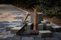 Hammer and trowel on the sidewalk with concrete bricks Royalty Free Stock Photo